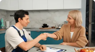Technician discussing appliance repair options with customer in Cupertino.